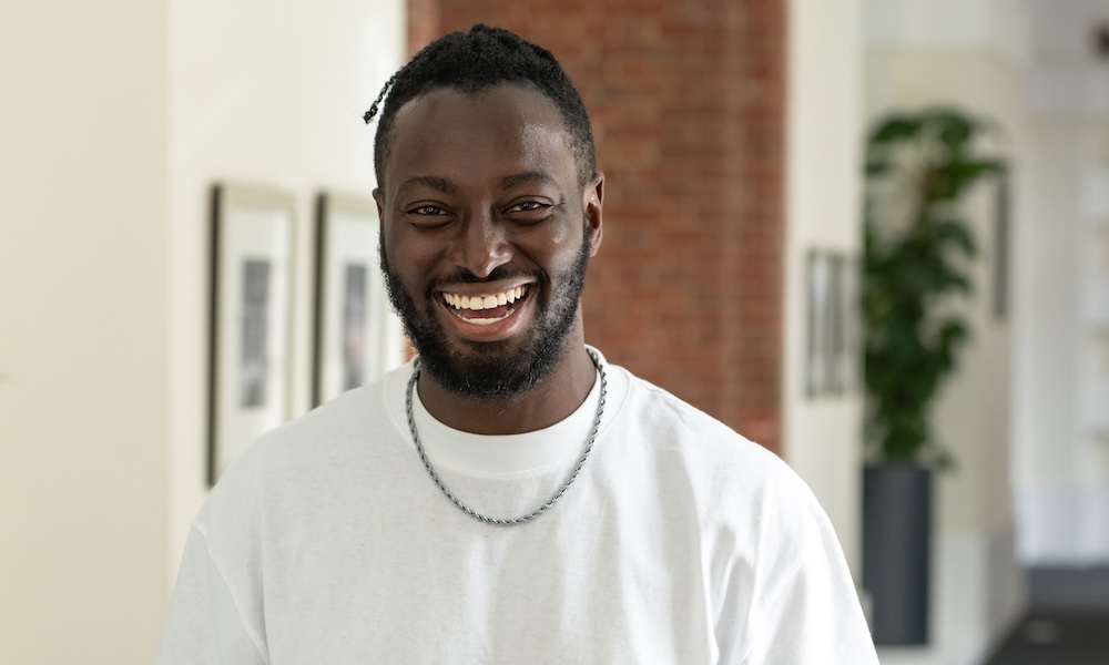 Happy black employee smiling