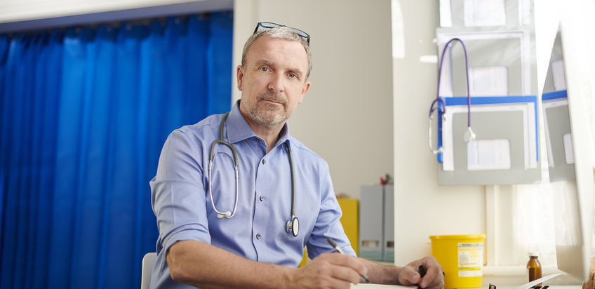 Male doctor in treatment room