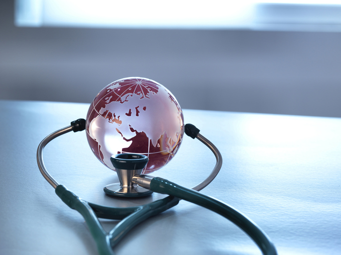 global Healthcare a glass globe and a stethoscope