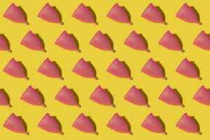 Pattern of rows of pink menstrual cups
