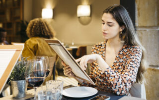 Women reading a menu in a restaurant