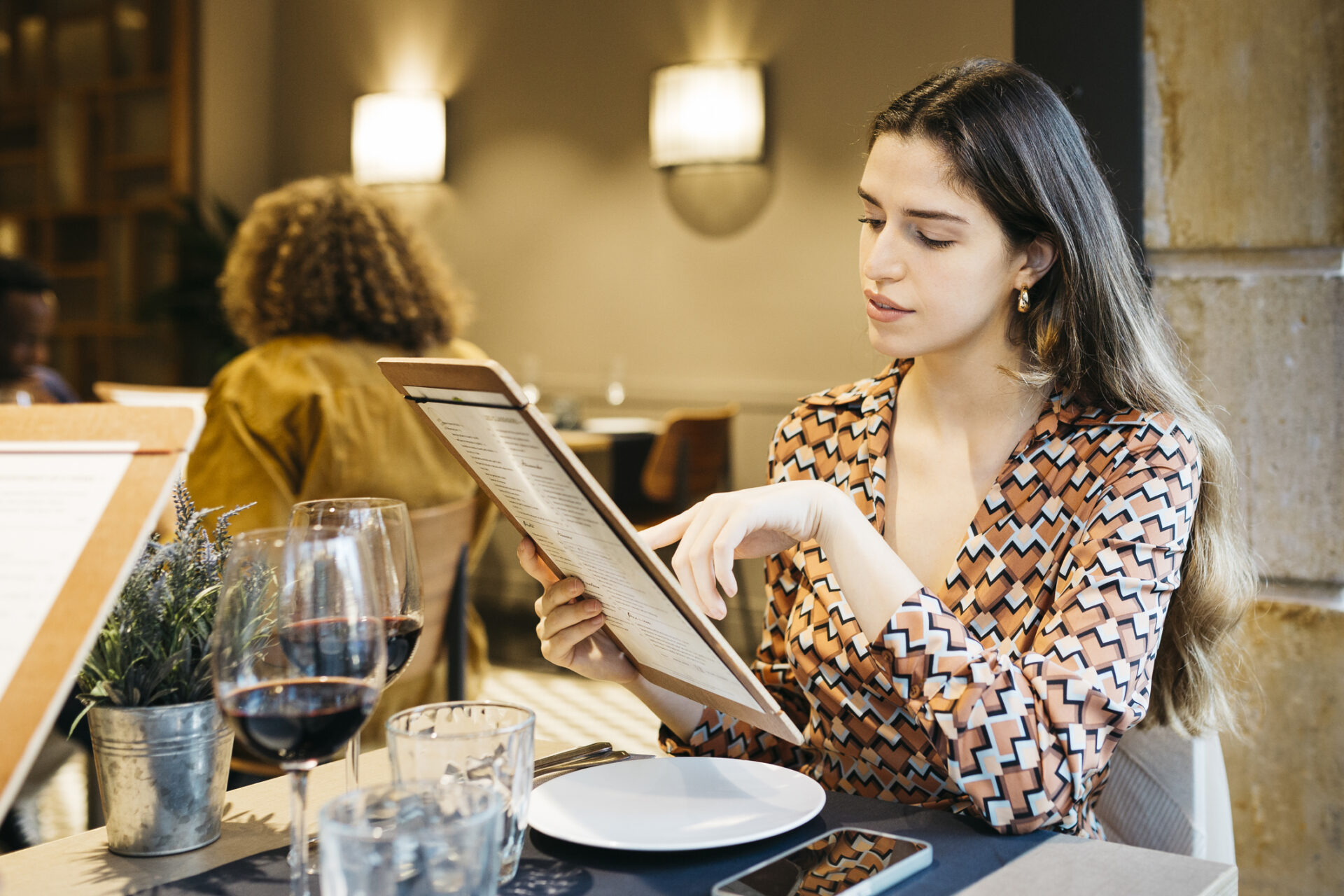 Women reading a menu in a restaurant