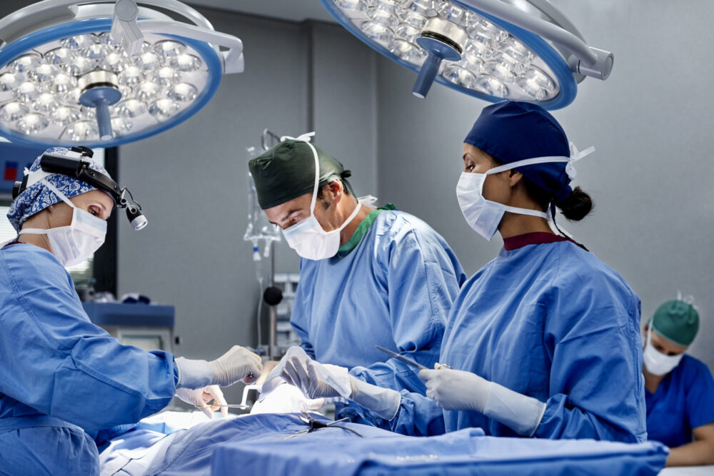 Female surgeon operating patient at emergency room