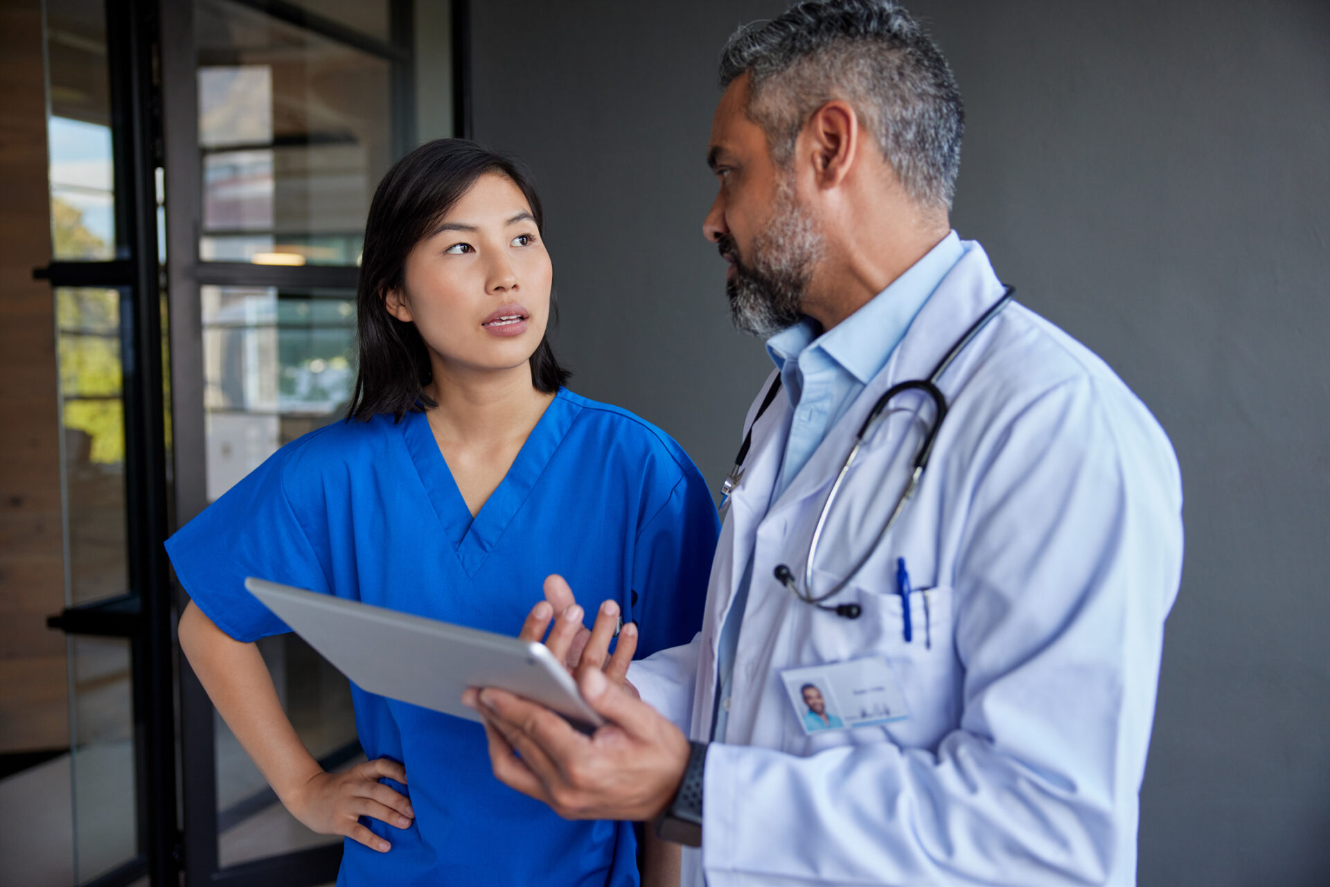 A doctor and nurse having a discussion