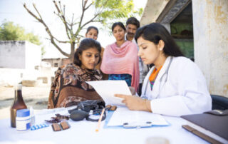 Indian doctor with patients