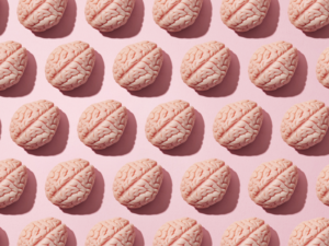 A collage of human brain graphics on a pink background