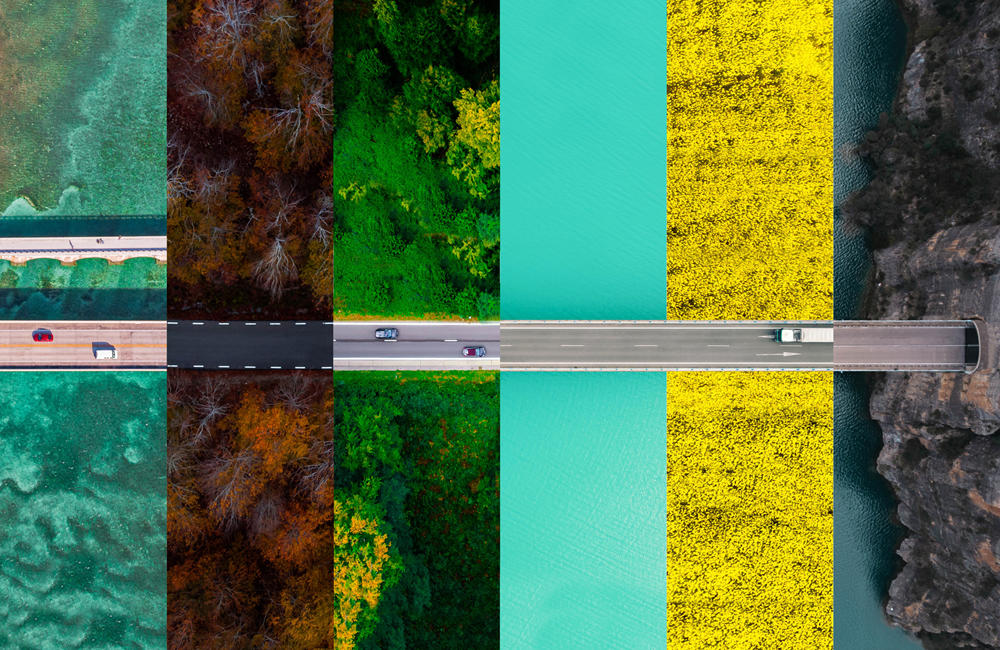 Image of a long road through different terrains